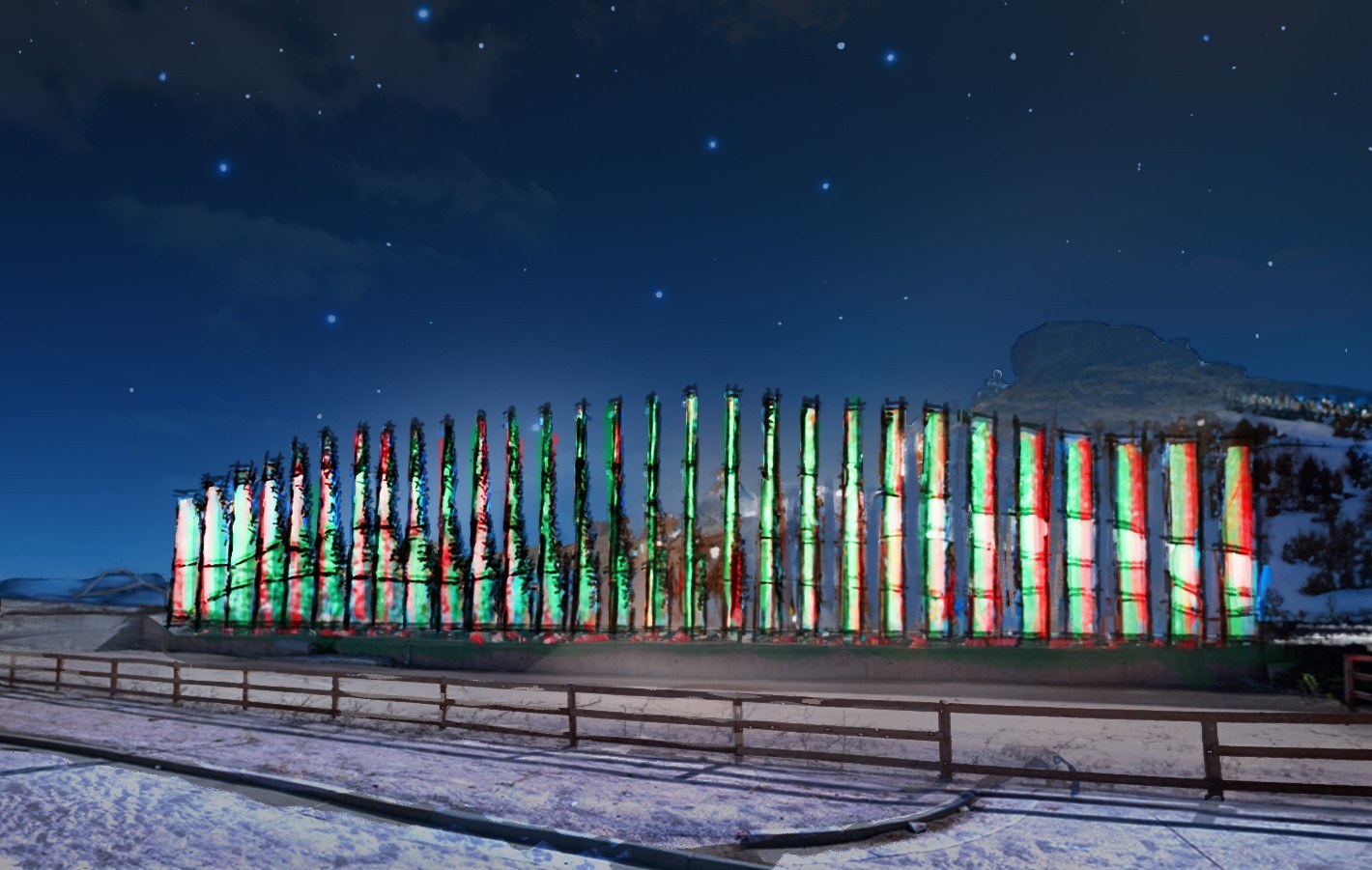 The sculpture lit at night in snow