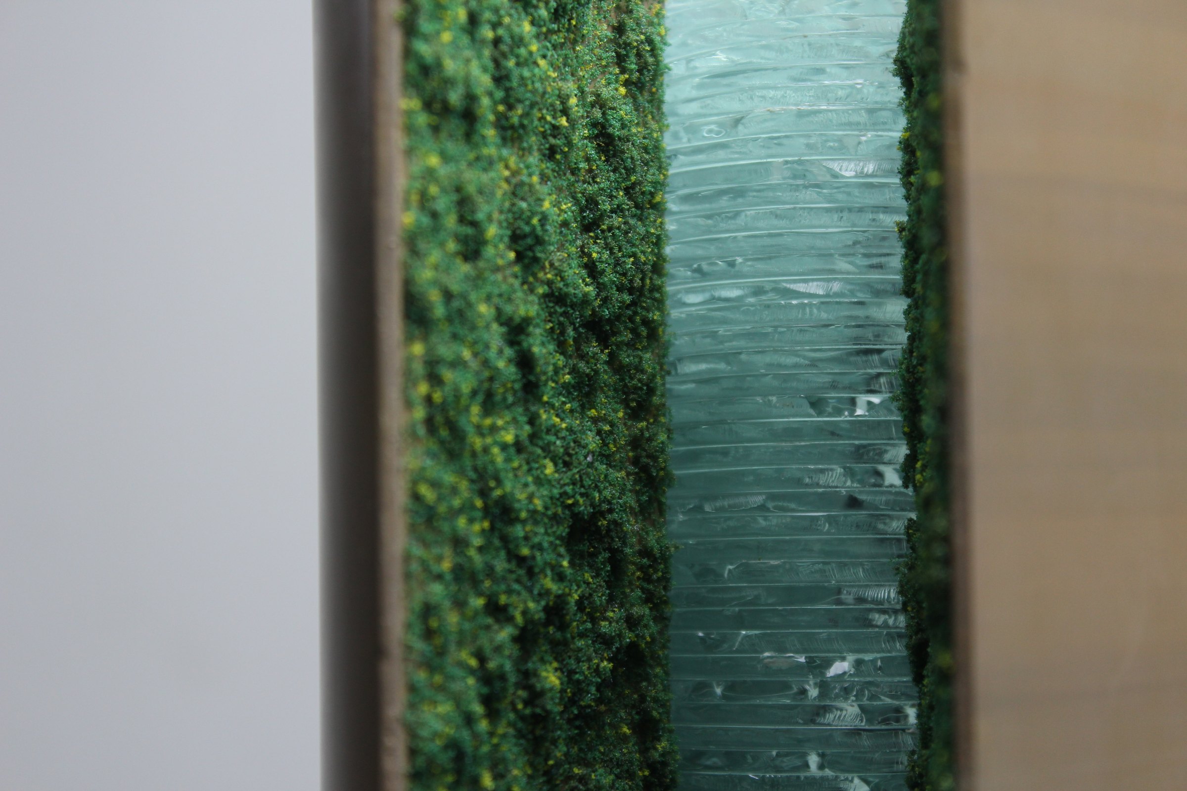 Texas Tech proposal model, the stacked glass core beside the living wall